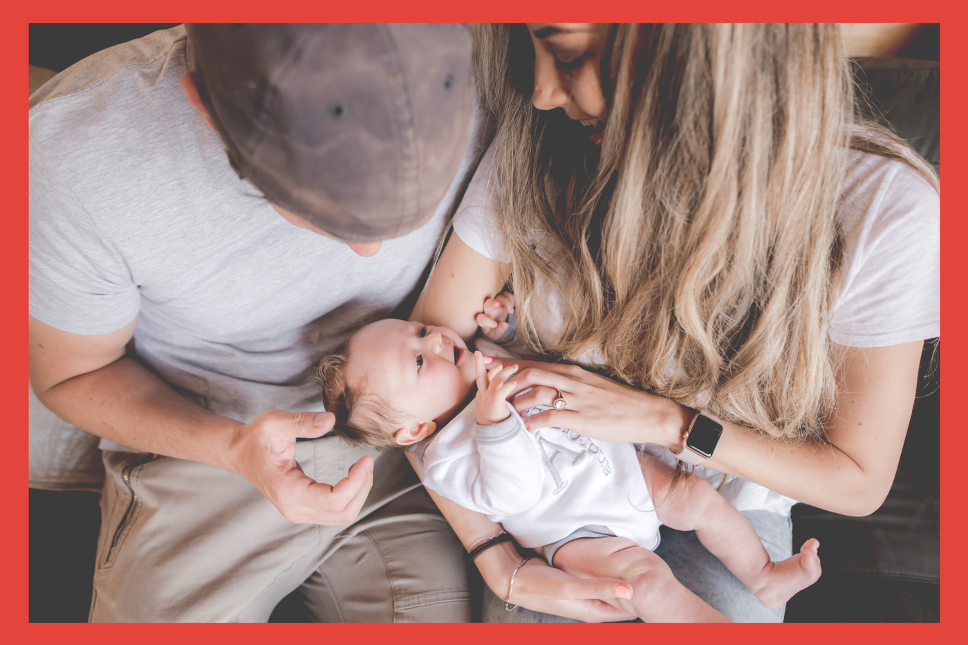 Mother. Father. Baby. Closeup. Cuddling. 